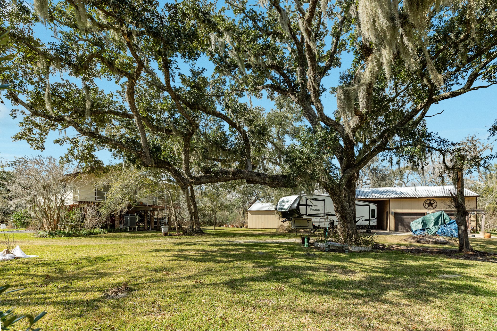 703 County Road 605 Angleton, TX 77515 - Photo 7 of 35 a swimming pool with outdoor seating and yard