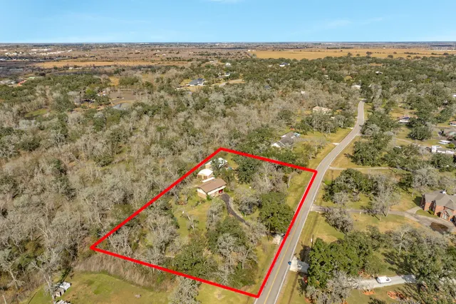 an aerial view of beach and residential space