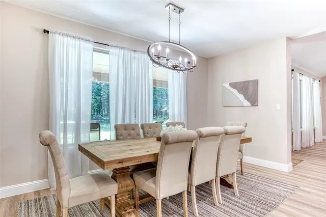 a dining room with furniture window wooden floor