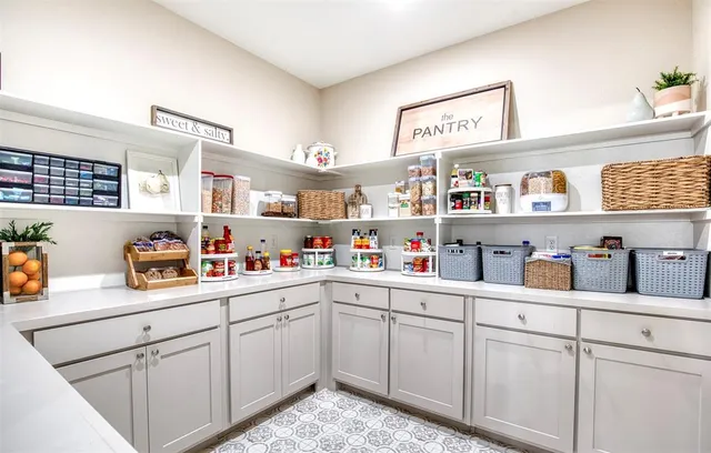 a kitchen with a sink dishwasher and cabinets