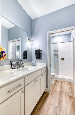 a spacious bathroom with a double vanity sink and a mirror