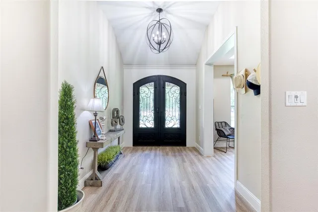 a view of entryway with wooden floor