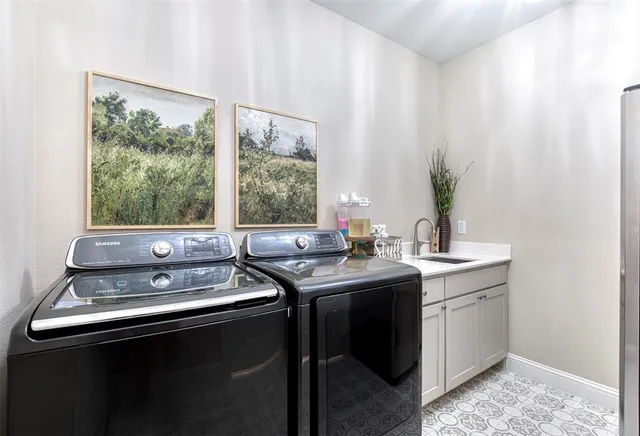 a view of a sink with chair and wooden floor