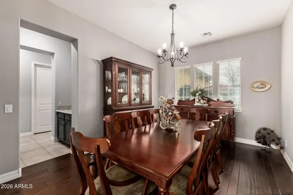 a large kitchen with granite countertop lots of counter space and a sink