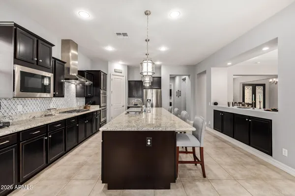 a living room with furniture and a ceiling fan