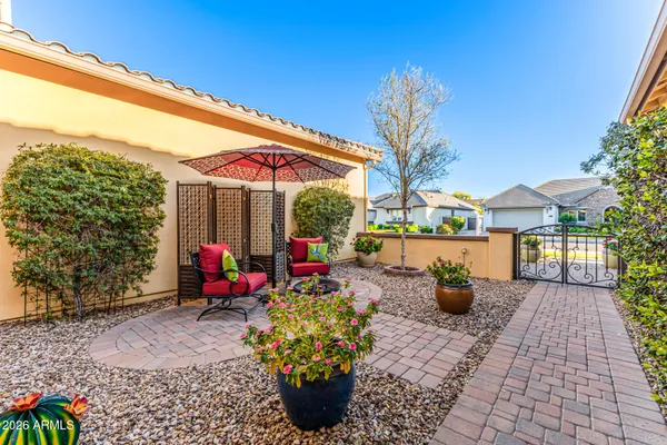 a view of a house with sitting area and garden