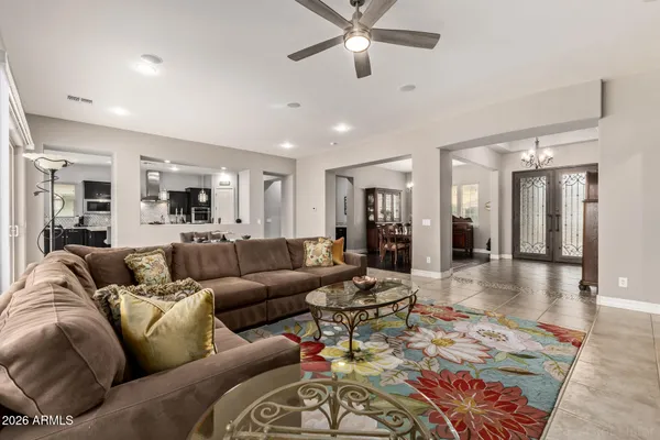 a kitchen with granite countertop a sink a counter top stainless steel appliances and cabinets