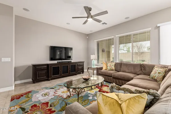 a large kitchen with kitchen island a sink a counter top stainless steel appliances and cabinets