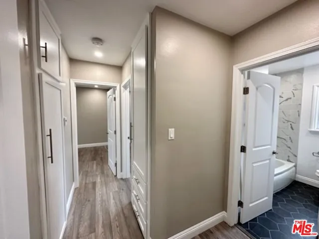 a bathroom with a glass shower door and a toilet