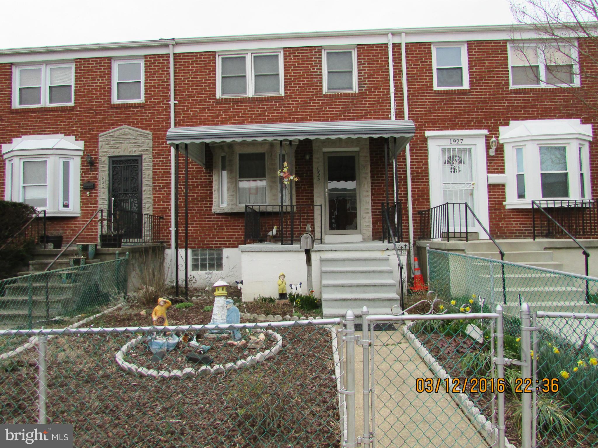 1925 Quentin Road Baltimore, MD 21222 - Photo 1 of 28 a front view of a house with a yard
