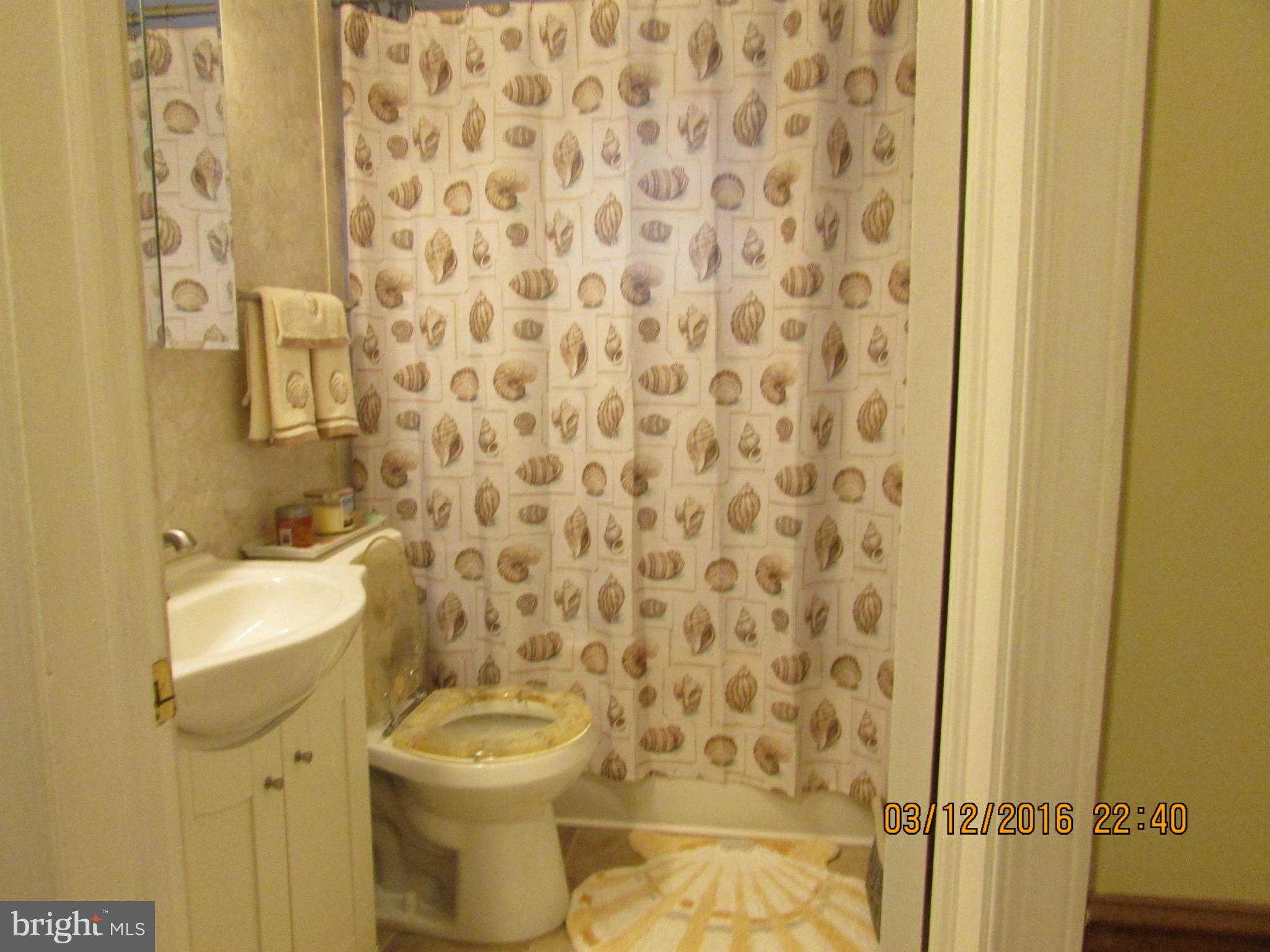 1925 Quentin Road Baltimore, MD 21222 - Photo 12 of 28 a bathroom with a toilet and a sink
