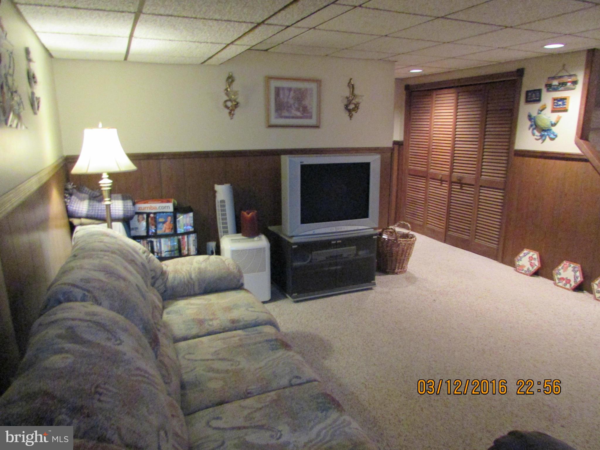 1925 Quentin Road Baltimore, MD 21222 - Photo 17 of 28 a living room with furniture and a fireplace