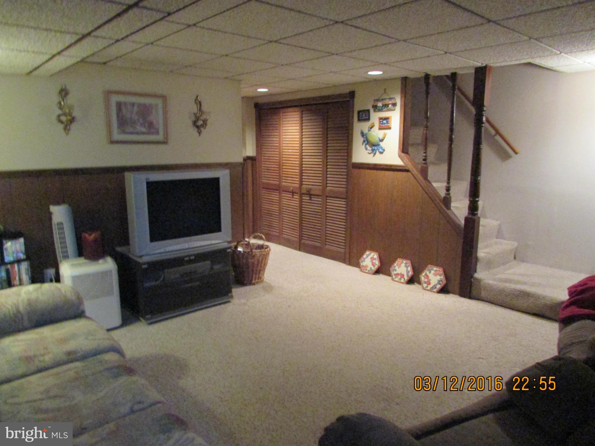 1925 Quentin Road Baltimore, MD 21222 - Photo 18 of 28 a living room with furniture and a flat screen tv