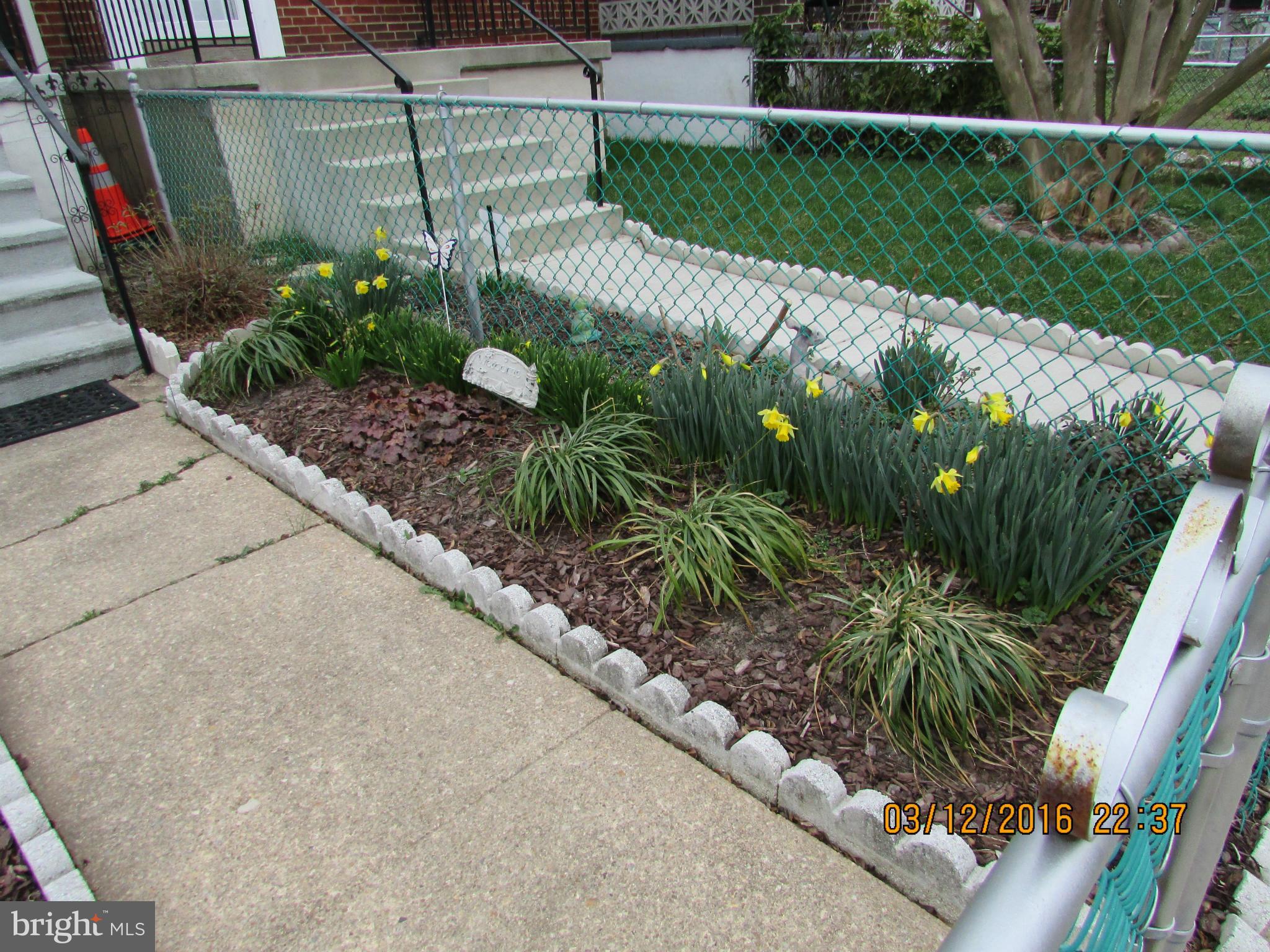 1925 Quentin Road Baltimore, MD 21222 - Photo 3 of 28 a view of a garden from a terrace