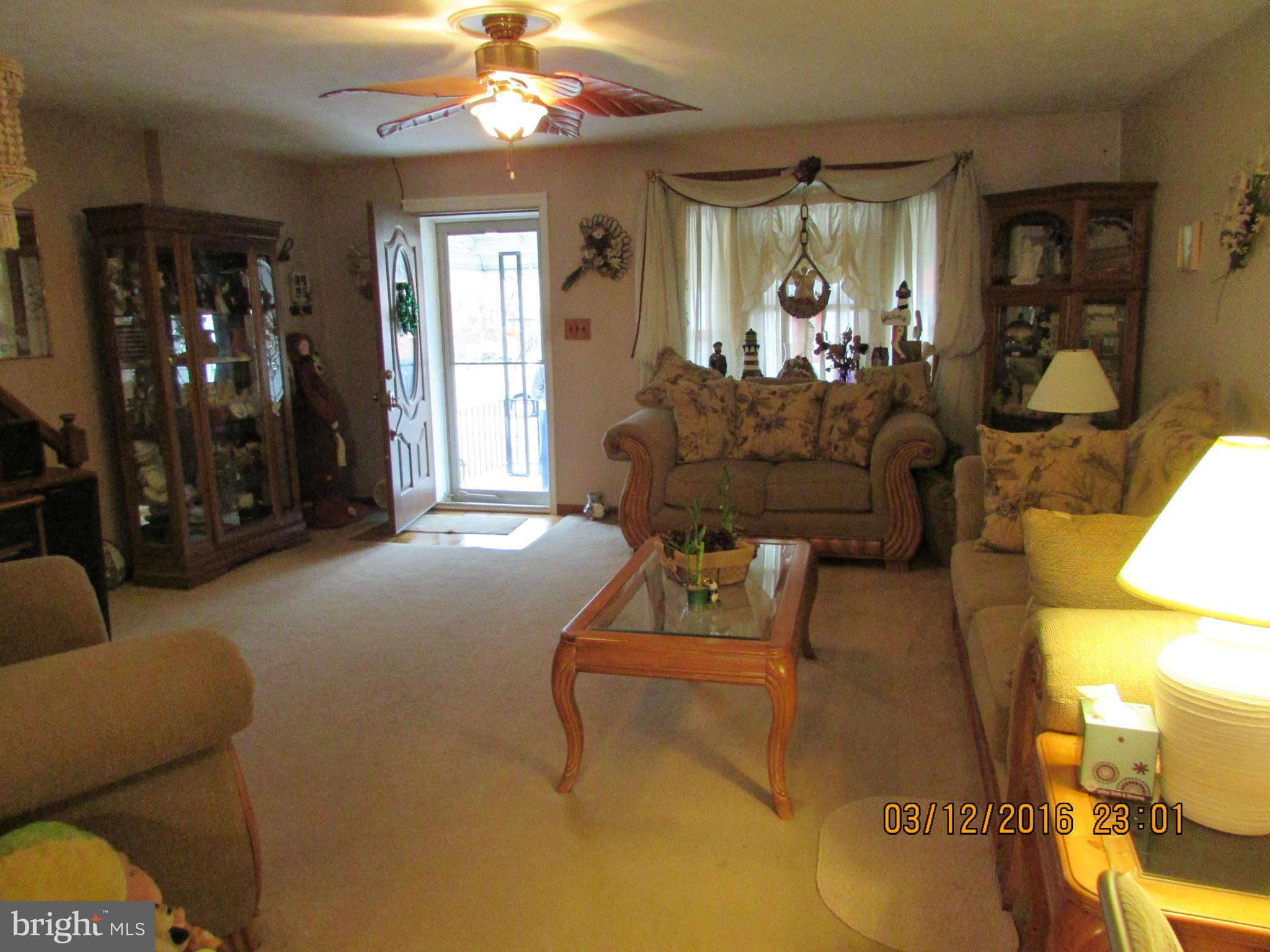 1925 Quentin Road Baltimore, MD 21222 - Photo 5 of 28 a living room with furniture and a large window