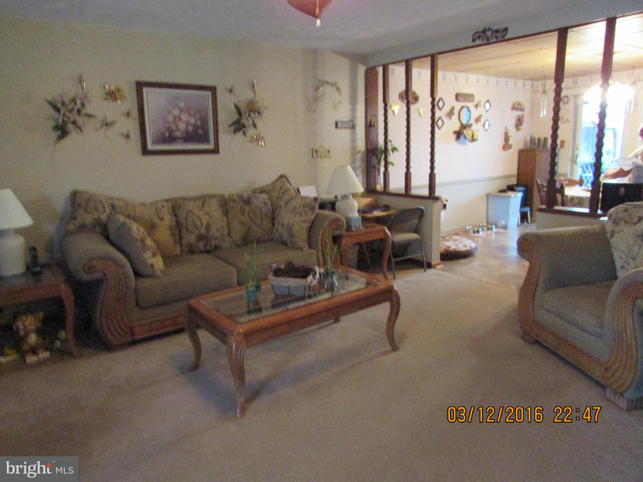 1925 Quentin Road Baltimore, MD 21222 - Photo 6 of 28 a living room with furniture and a large window