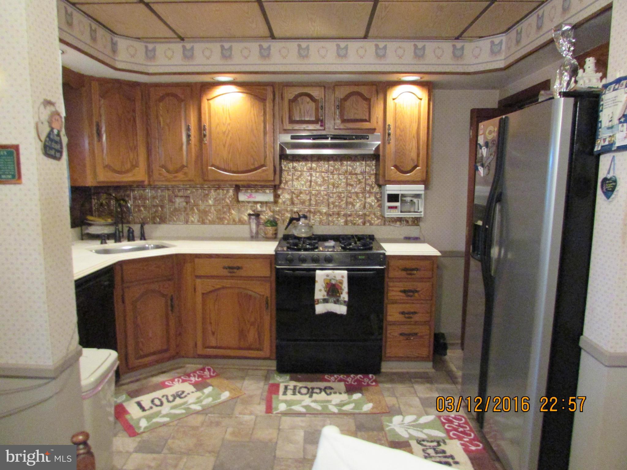 1925 Quentin Road Baltimore, MD 21222 - Photo 8 of 28 a bathroom with a sink a toilet and mirror