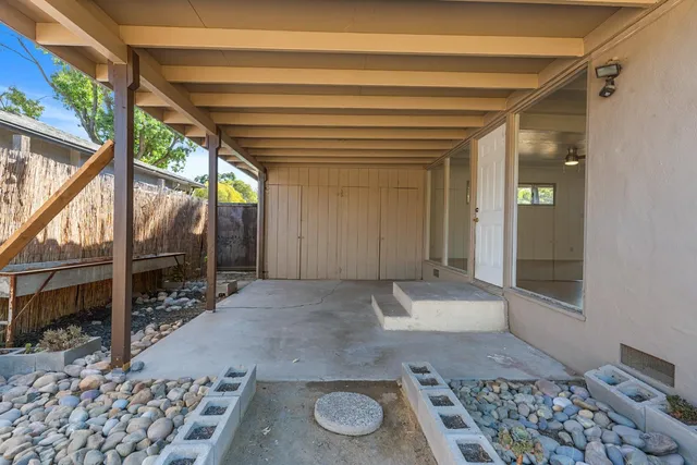 a view of an entryway with a floor to ceiling window