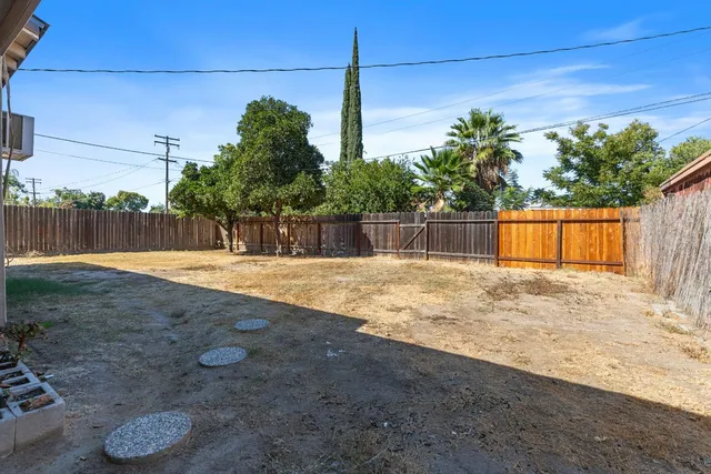 a swimming pool with some trees in the background