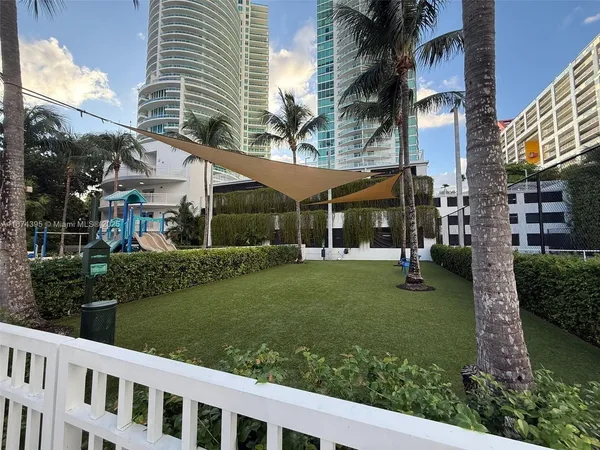 a view of a house with a yard and plants