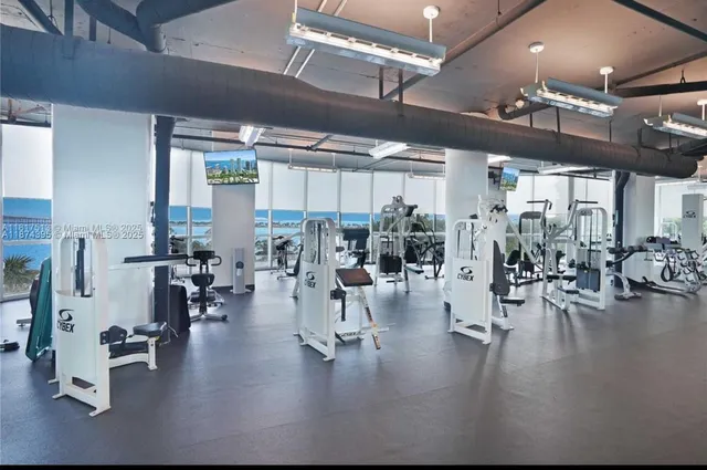 a view of a room with lots of wooden furniture