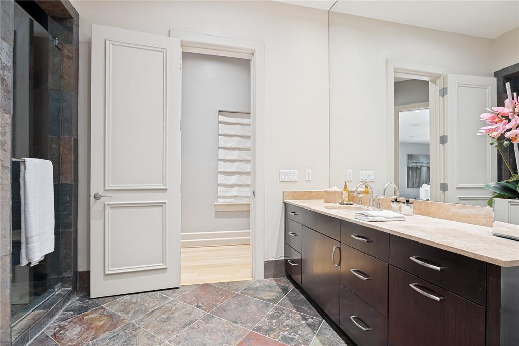 6432 Sudbury Road Plano, TX 75024 - Photo 25 of 38 a bathroom with a double vanity sink and a mirror