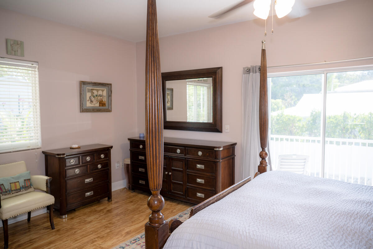 464 Lime Drive Key Largo, FL 33037 - Photo 20 of 96 a bedroom with a bed and a dresser