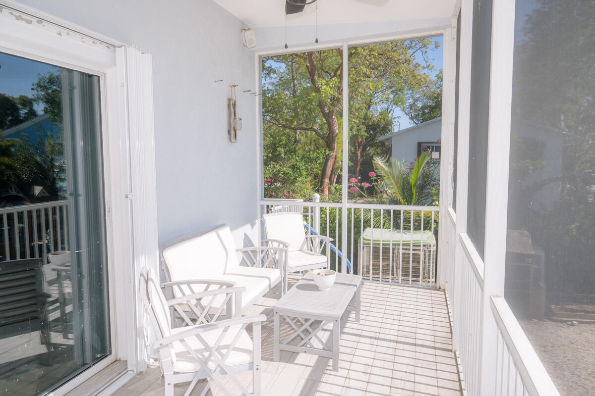 464 Lime Drive Key Largo, FL 33037 - Photo 28 of 96 a view of a balcony with wooden floor