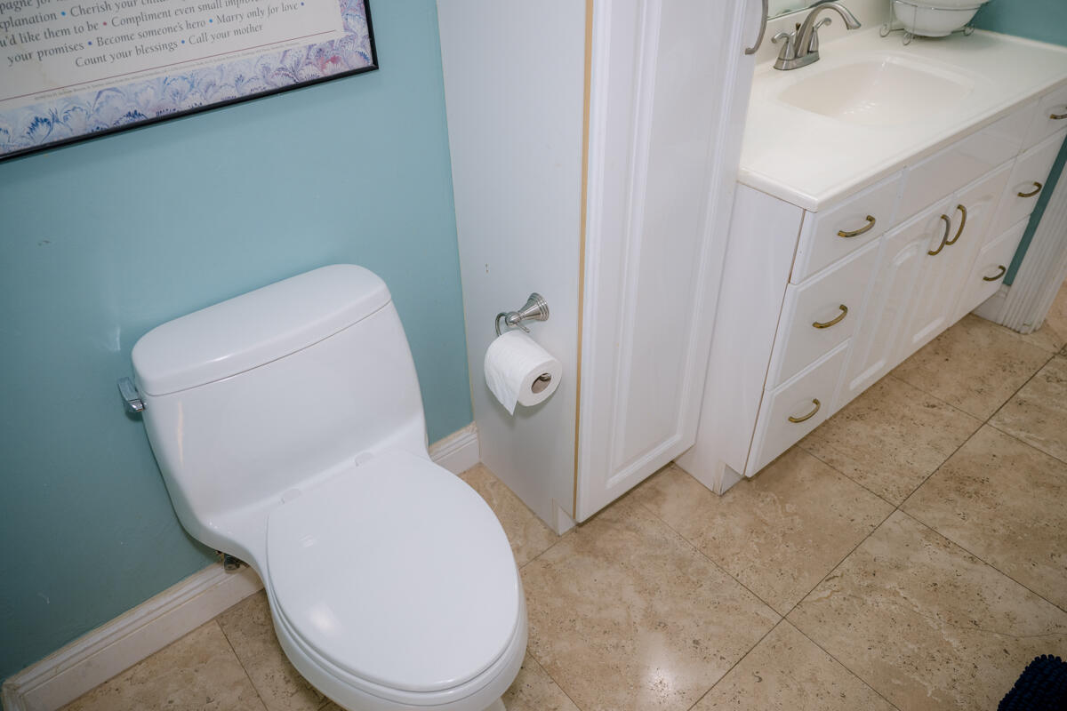 464 Lime Drive Key Largo, FL 33037 - Photo 32 of 96 a bathroom with a toilet and a sink