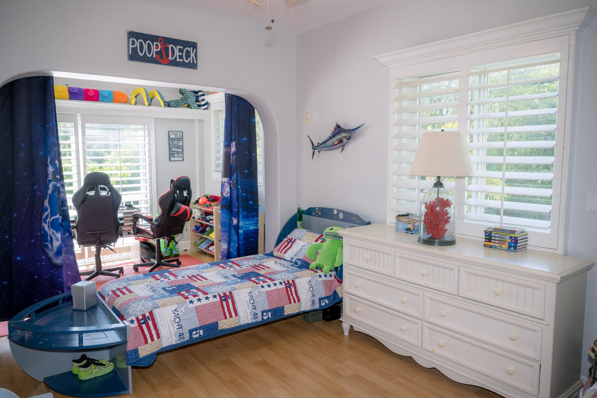 464 Lime Drive Key Largo, FL 33037 - Photo 35 of 96 a bedroom with bed and a window