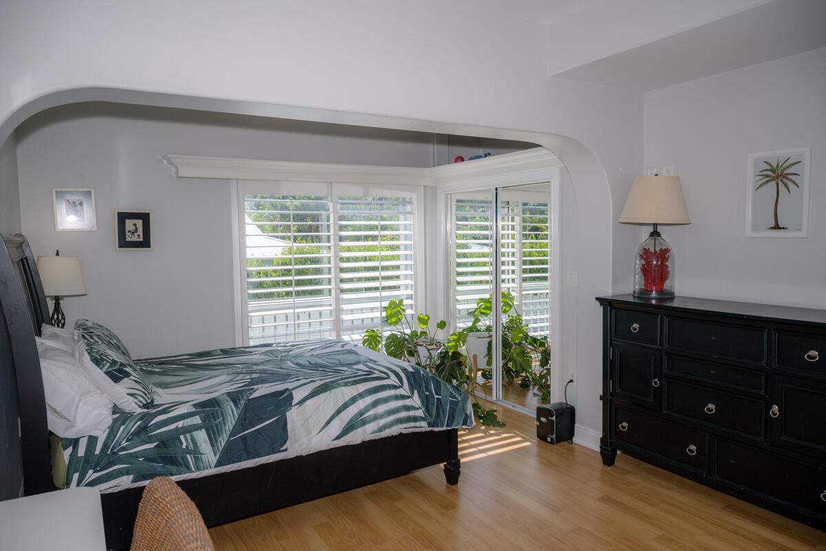 464 Lime Drive Key Largo, FL 33037 - Photo 41 of 96 a spacious bedroom with a bed and a dresser