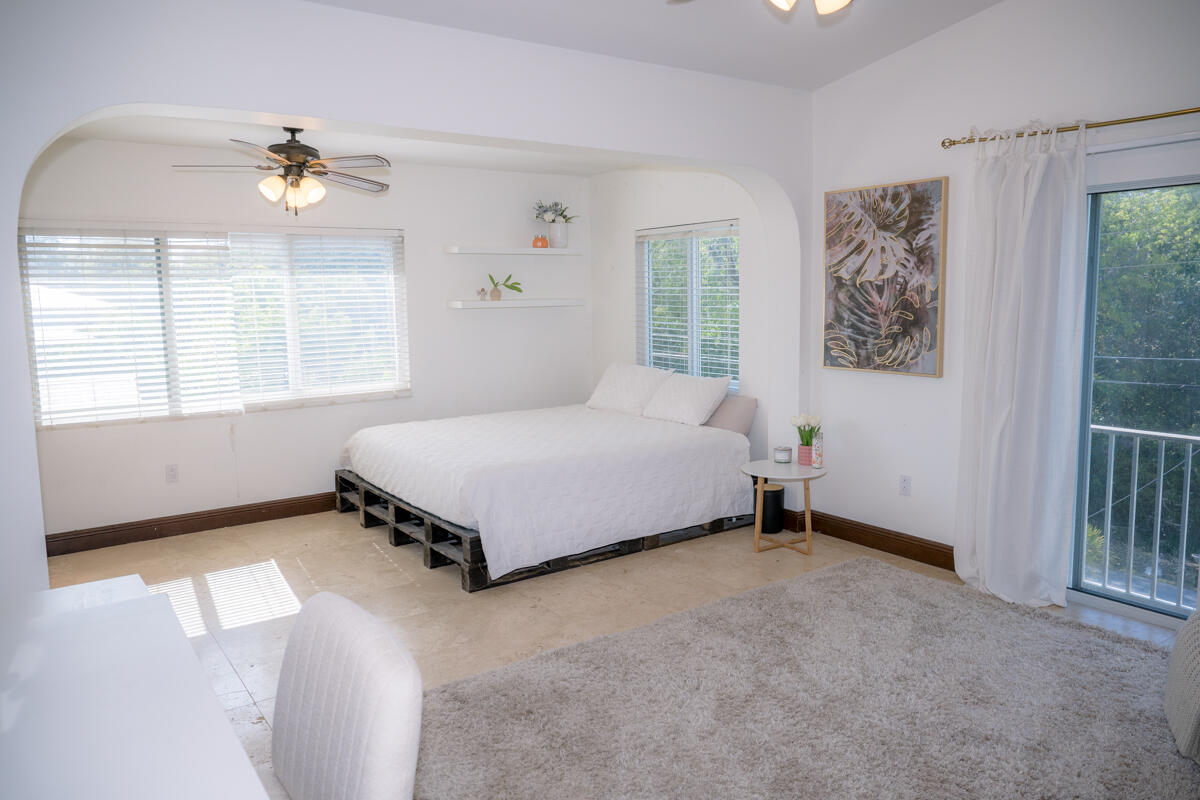464 Lime Drive Key Largo, FL 33037 - Photo 49 of 96 a bedroom with a bed and a window