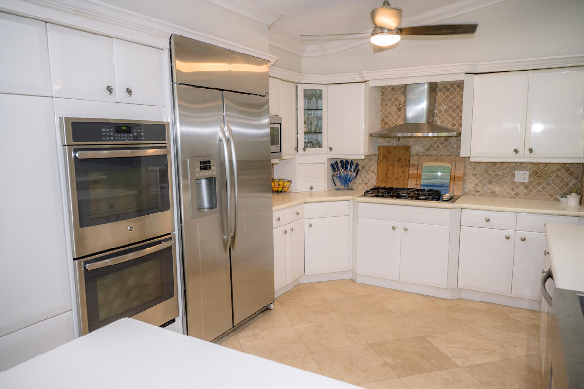 464 Lime Drive Key Largo, FL 33037 - Photo 61 of 96 a kitchen with granite countertop a refrigerator sink and cabinets