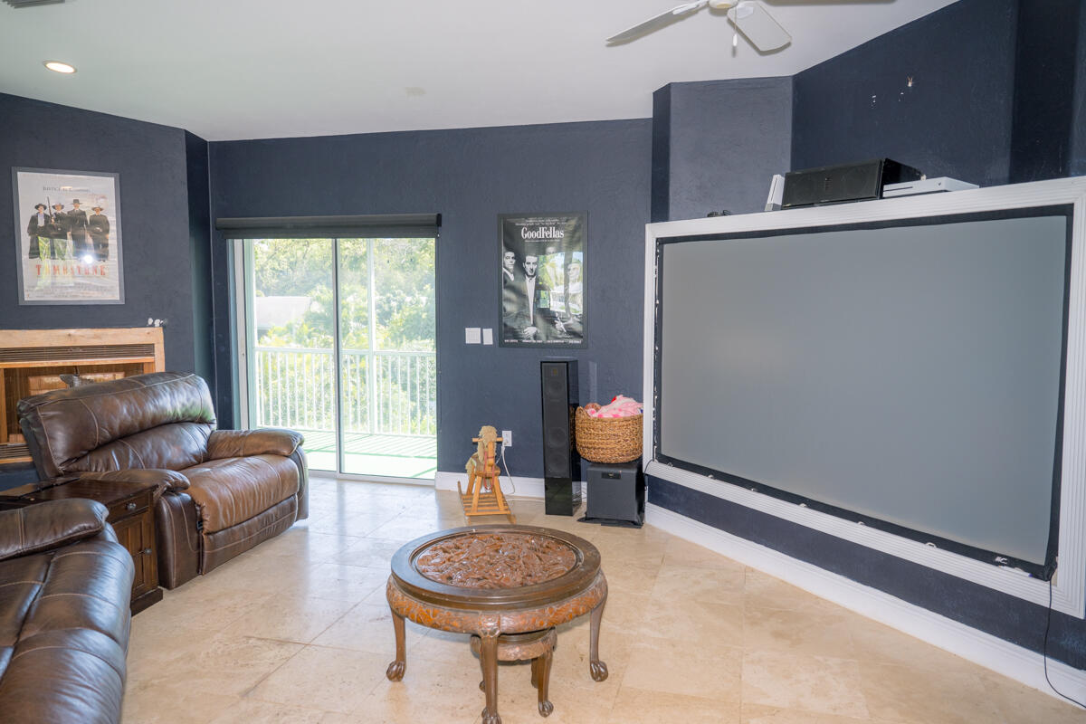464 Lime Drive Key Largo, FL 33037 - Photo 79 of 96 a living room with furniture a window and a chandelier