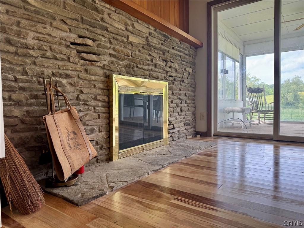 7043 Hutches Road Bath, NY 14810 - Photo 23 of 32 Family room with fireplace