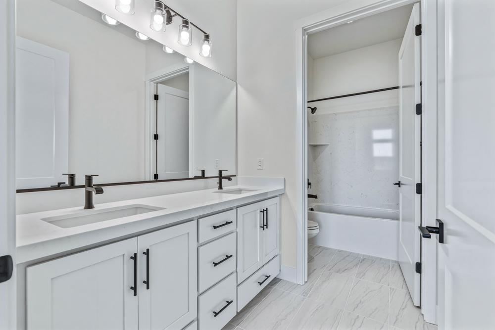 7056 Dalton Rnch Drive Rancho Murieta, CA 95683 - Photo 28 of 29 a bathroom with a double vanity sink mirror and double