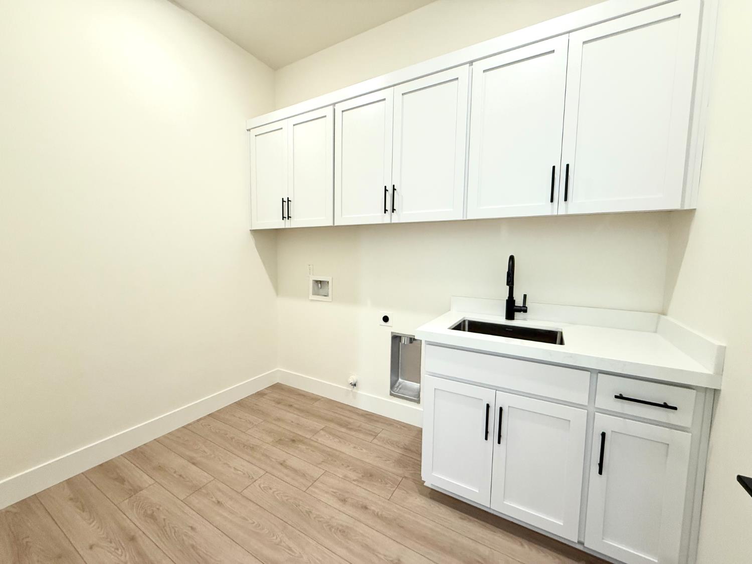7056 Dalton Rnch Drive Rancho Murieta, CA 95683 - Photo 10 of 29 a kitchen with white cabinets and a sink