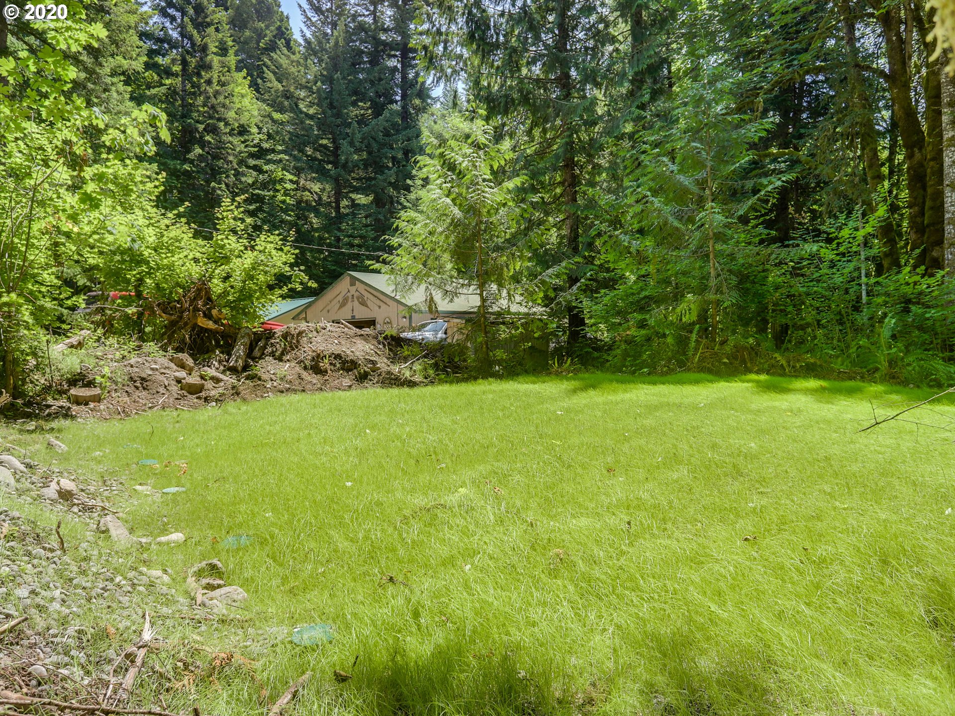 0 East Terrace Drive Rhododendron, OR 97049 - Photo 1 of 17 a backyard of a house with large trees