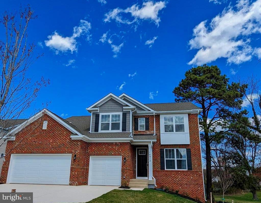 14972 Walter Robinson Lane Haymarket, VA 20169 - Photo 1 of 30 a front view of a house with a garden
