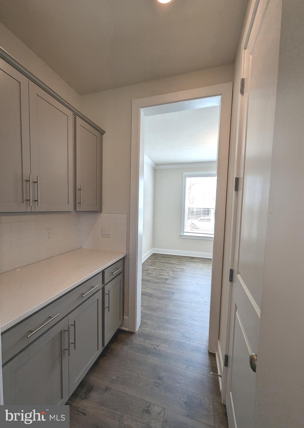 14972 Walter Robinson Lane Haymarket, VA 20169 - Photo 13 of 30 a view of an empty room with wooden floor and closet