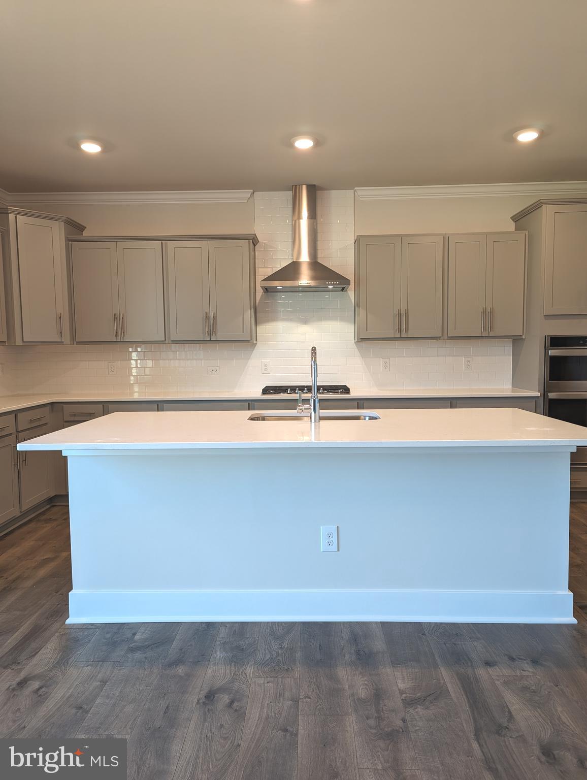 14972 Walter Robinson Lane Haymarket, VA 20169 - Photo 18 of 30 a view of kitchen with kitchen island sink and center island