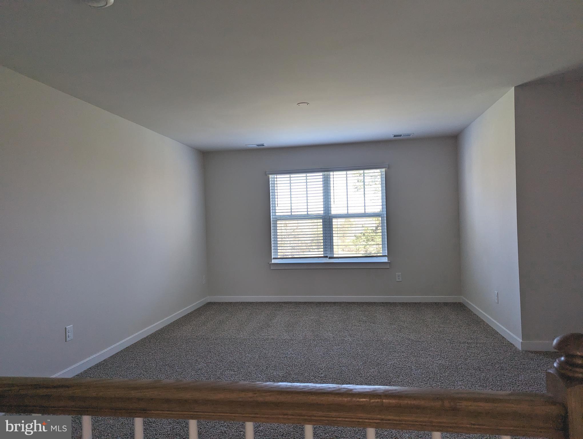 14972 Walter Robinson Lane Haymarket, VA 20169 - Photo 24 of 30 an empty room with wooden floor and windows