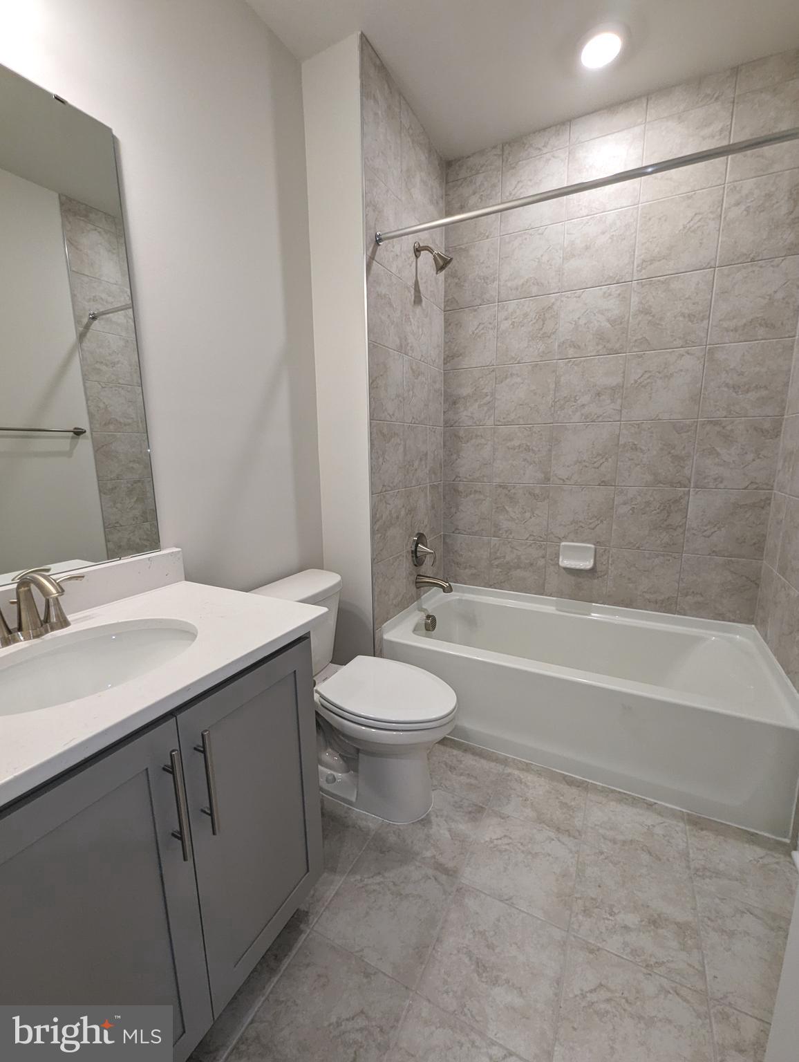 14972 Walter Robinson Lane Haymarket, VA 20169 - Photo 27 of 30 a bathroom with a sink a toilet and shower