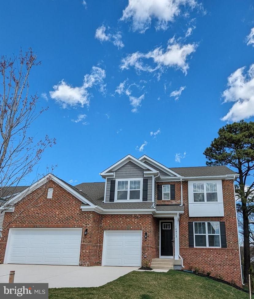 14972 Walter Robinson Lane Haymarket, VA 20169 - Photo 28 of 30 a front view of a house with garden