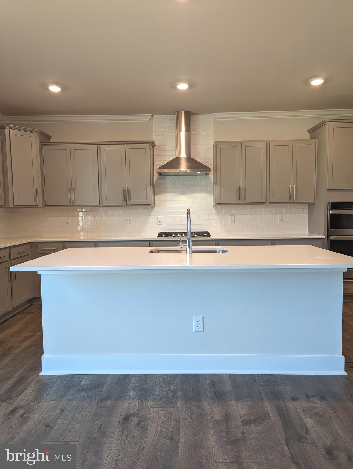 14972 Walter Robinson Lane Haymarket, VA 20169 - Photo 6 of 30 a view of kitchen with kitchen island sink and center island