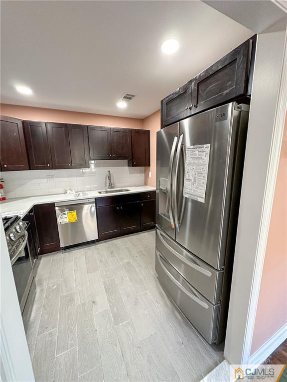 4301 Hana Road Edison, NJ 08817 - Photo 7 of 37 a kitchen with stainless steel appliances a refrigerator and a stove
