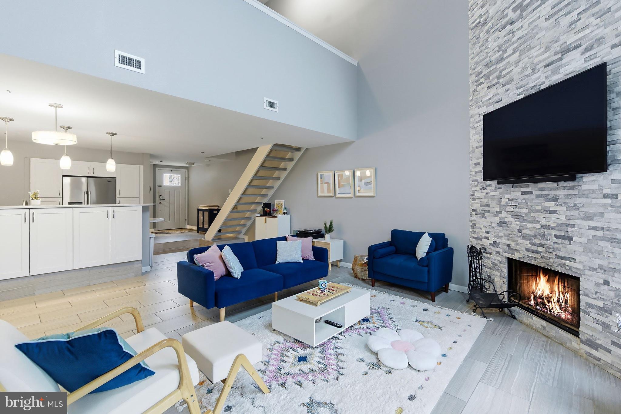 Modern living space with cozy fireplace.