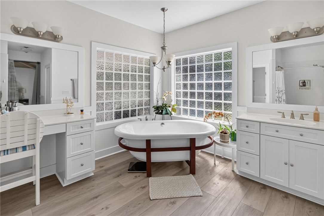 1504 Double Springs Road Townville, SC 29689 - Photo 18 of 49 Natural light pours through dual glass-block windows highlighting the soaking tub and double vanities.