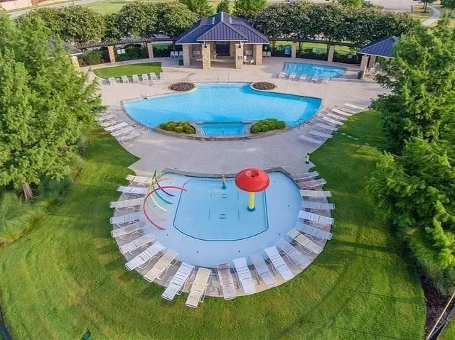 a view of a swimming pool with lounge chair