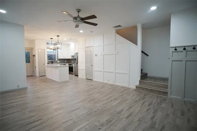 a kitchen with a table and chairs
